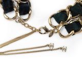 a black and gold necklace with a chain attached to it