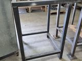 two tables that are sitting in the middle of a room