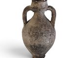 an old vase that is sitting on a white surface