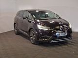 a picture of a dark colored car parked in a showroom
