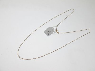 gros plan d'un collier auquel est attachée une étiquette