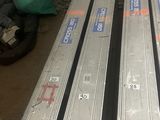many different types of steel bars stacked on top of each other