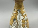 un vase sur lequel sont représentés une femme et un homme