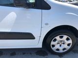 a small white van parked in a parking lot