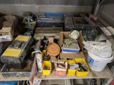 a lot of boxes and tools on a shelf