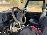 a car that has a steering wheel and a bag in it