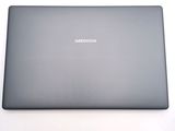 a laptop that is sitting on a white surface