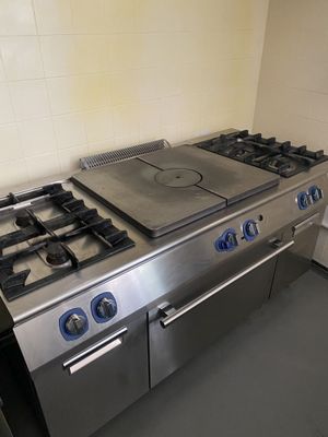 a stainless steel stove and oven in a kitchen