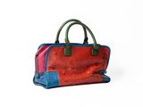 an image of a red and blue handbag sitting on top of a white surface