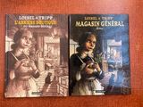 deux livres sont posés l'un à côté de l'autre sur une table