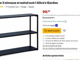 the shelf is black and has three shelves on each shelf