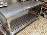 a stainless steel table with a scale on top of it
