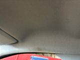 a picture of a red and blue object in the back seat of a car
