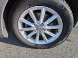 a close up of a tire on a car ' s rim