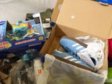 a box full of toys and other items on the floor