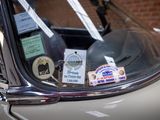 a close up of a car window with stickers on it