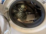 a washing machine that is sitting on the floor