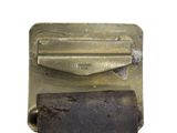 a piece of metal that has a piece of rust on it