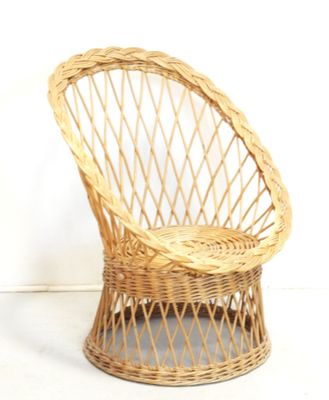 a wicker chair that is sitting on the floor