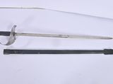 pair of old swords on a white surface with a knife in the middle