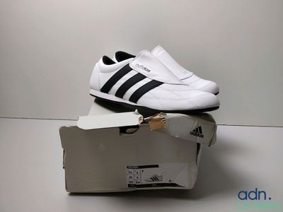 a pair of shoes that are on top of a box