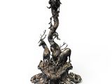 bronze sculpture of a tree with animals and a bird on it