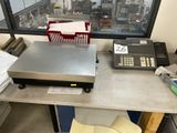 a machine that is sitting on a table in front of a window