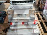 a stack of metal items on a pallet in a warehouse