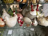 a glass display case with many different types of vases on it
