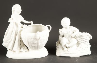 two figurines of a boy and a girl with a basket