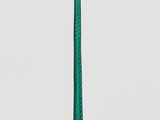 une lampe de table verte surmontée d'un abat-jour blanc