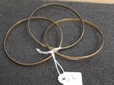 three rings with a price tag on them on a table