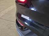 a close up of a car ' s tail light on the street