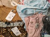 a pile of clothes that is sitting on a table