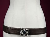 a close up of a mannequin torso with a belt on it