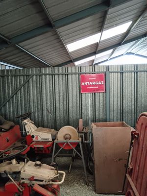 a garage with a lot of junk in it