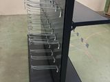 an image of a metal shelf with many chairs on it