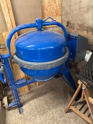 a blue machine that is sitting in a room