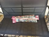 a bag of candy sitting on a chair on the patio