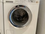 a washer and a dryer in a small room