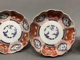 three plates with different designs on them sitting next to each other