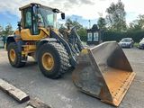 a picture of a large wheel loader in a parking lot