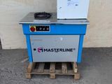 the machine is sitting on a pallet next to a wall