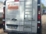 a white van with a ladder on the back of it