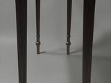 a small wooden table with a drawer on top of it