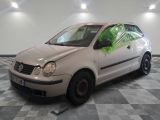 a white car that is parked on a checkered floor