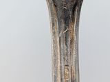 an image of a close up of a metal object with a bird on it