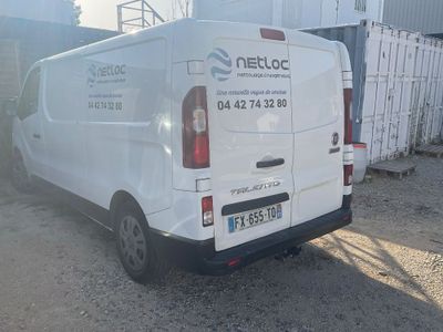 a white van that is parked on the side of the road