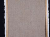 an easel with a painting on it and a black background