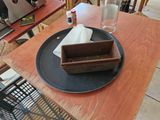 a plate that has a napkin on it on a table